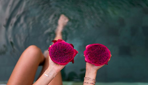 Dragon fruit on girl hands